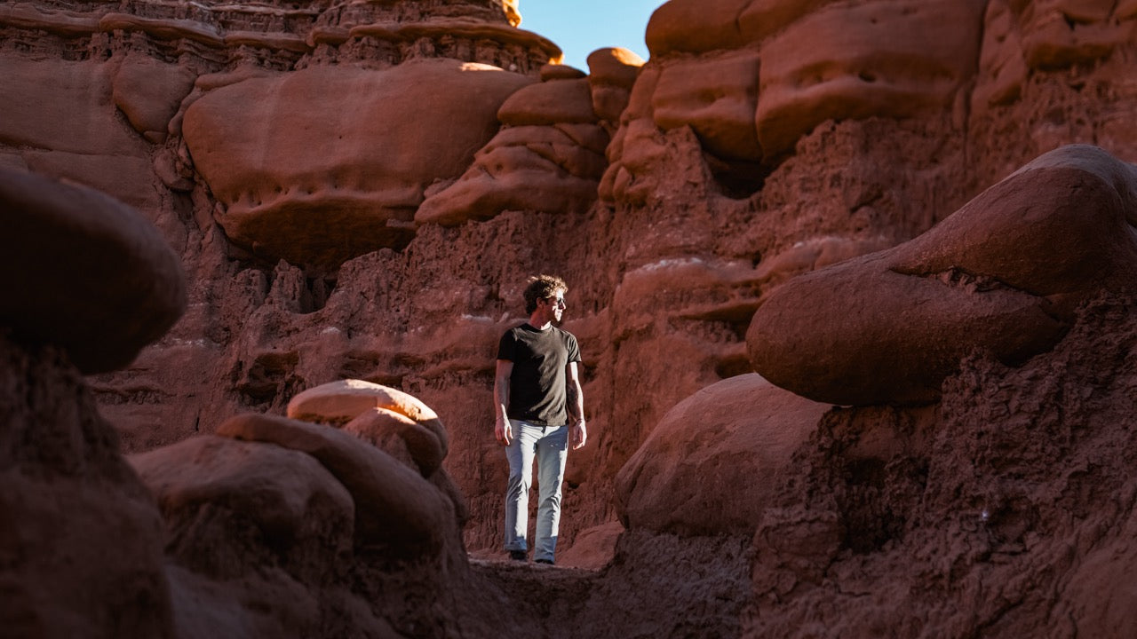 man standing in a canyon wearing rob roy nebu mens pants